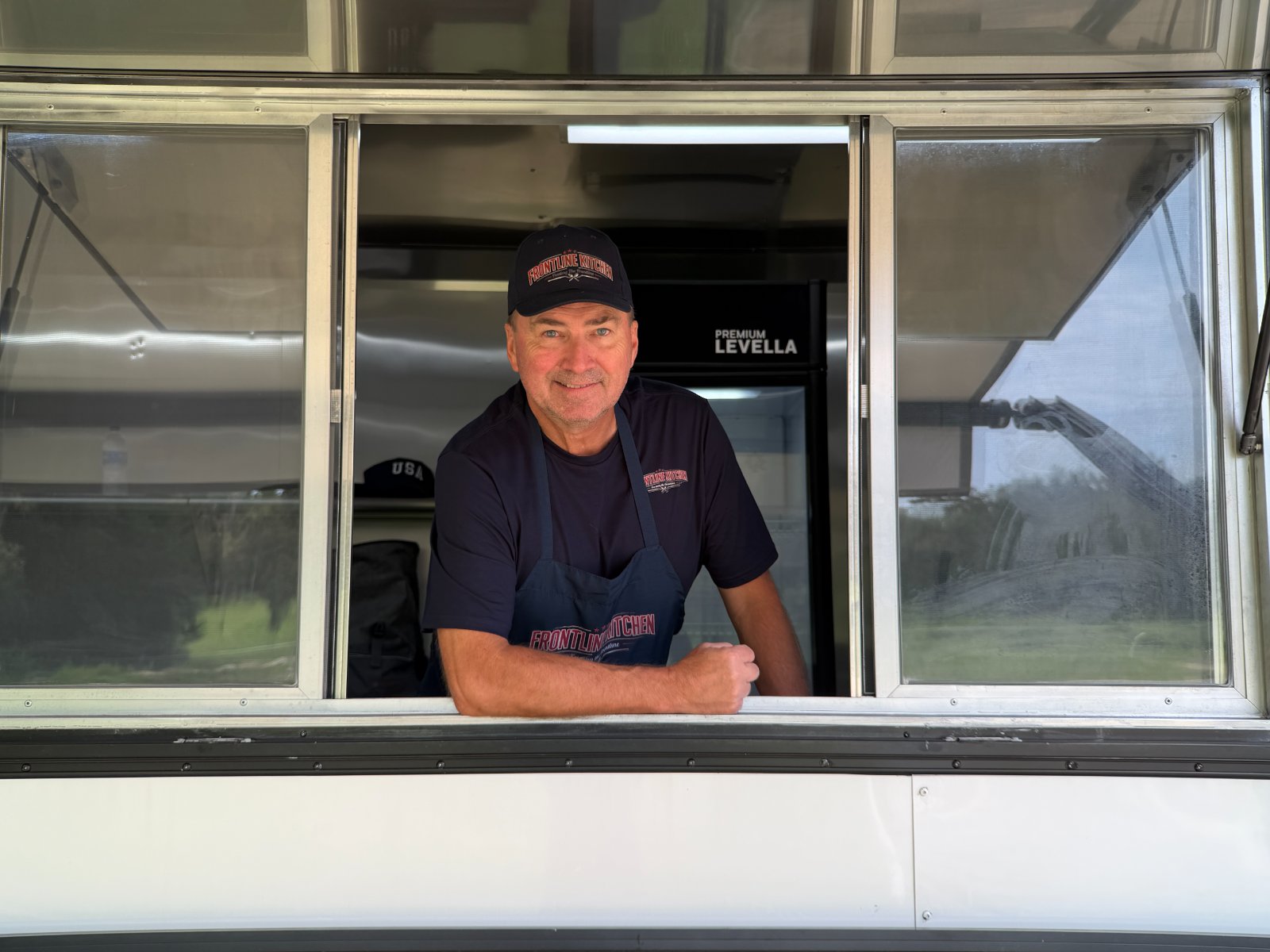 Frontline Kitchen founder leaning out of the truck window